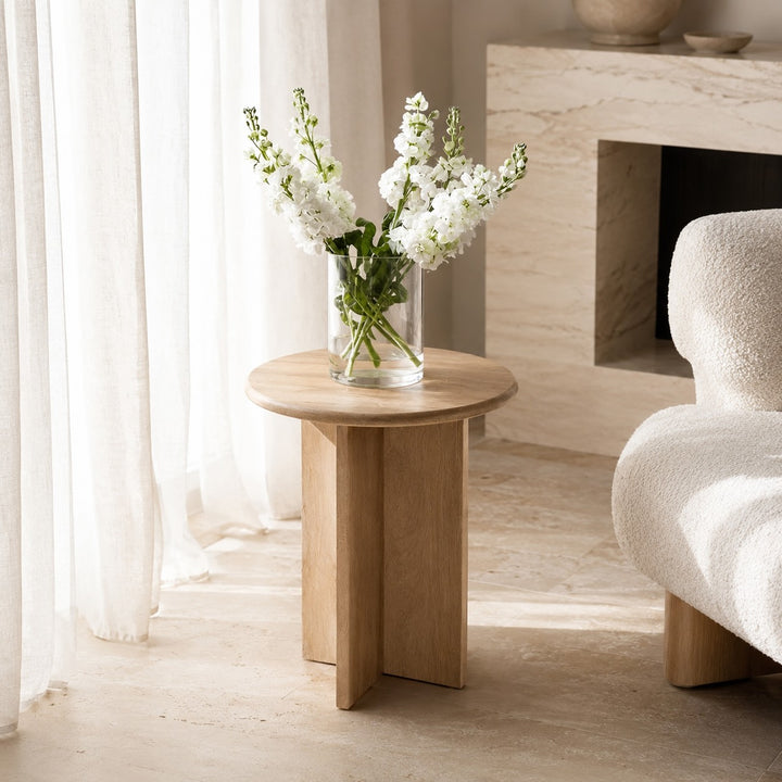 Minimalist Round Side Table in Natural Travertine with Intersecting Base for Compact Spaces