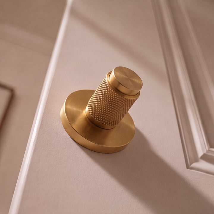 Modern Brass Door Handle Set with Knurled Grip and Circular Base for Internal Doors