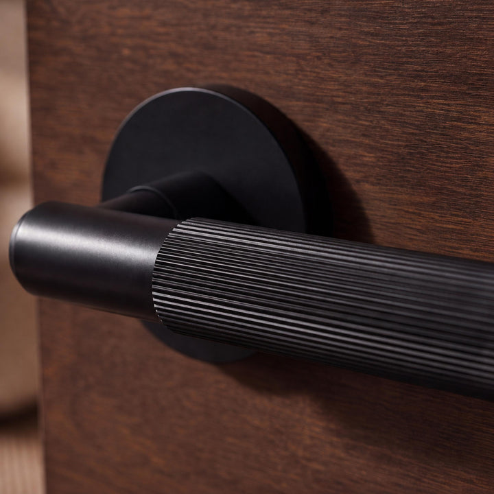 Modern Brass Door Handle Set with Knurled Grip and Emergency Access Lock for Internal Doors