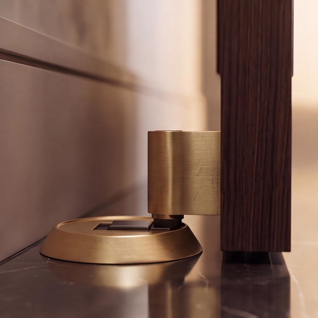 Modern Brass Door Stop with Cylindrical Design and Soft-Touch Mechanism for Floor Protection