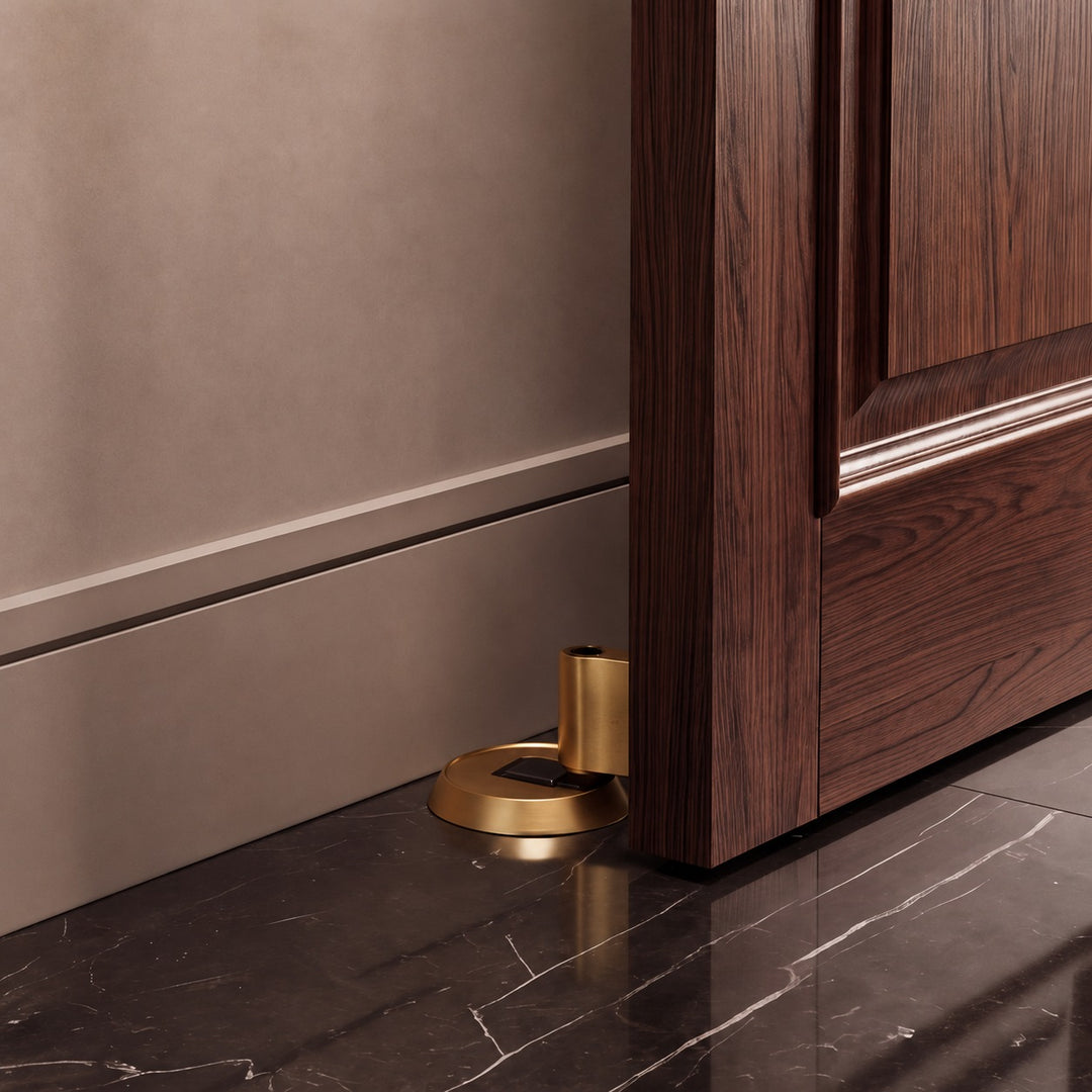Modern Brass Door Stop with Cylindrical Design and Soft-Touch Mechanism for Floor Protection