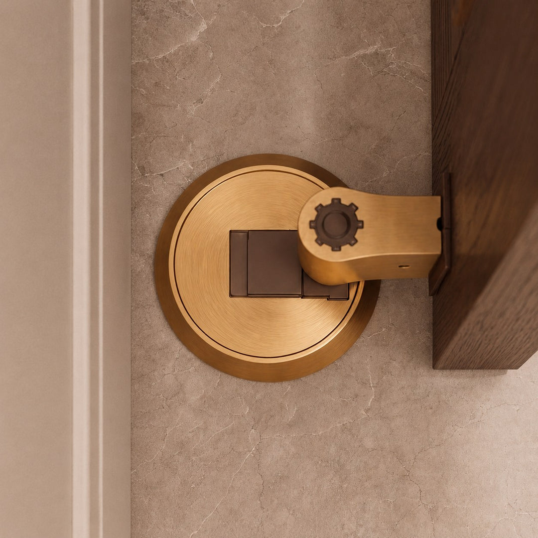 Modern Brass Door Stop with Cylindrical Design and Soft-Touch Mechanism for Floor Protection
