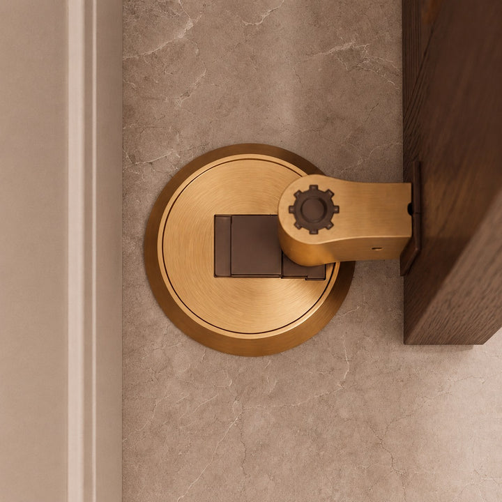 Modern Brass Door Stop with Cylindrical Design and Soft-Touch Mechanism for Floor Protection