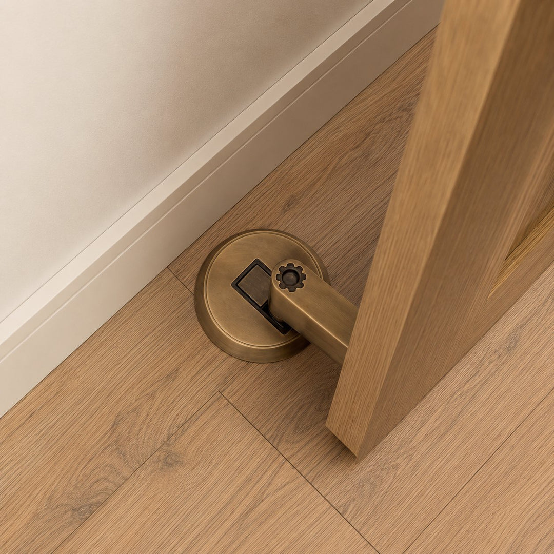 Modern Brass Door Stop with Cylindrical Design and Soft-Touch Mechanism for Floor Protection