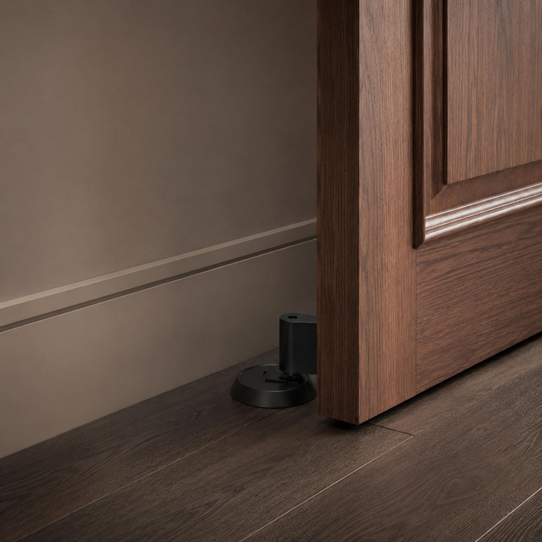 Modern Brass Door Stop with Cylindrical Design and Soft-Touch Mechanism for Floor Protection
