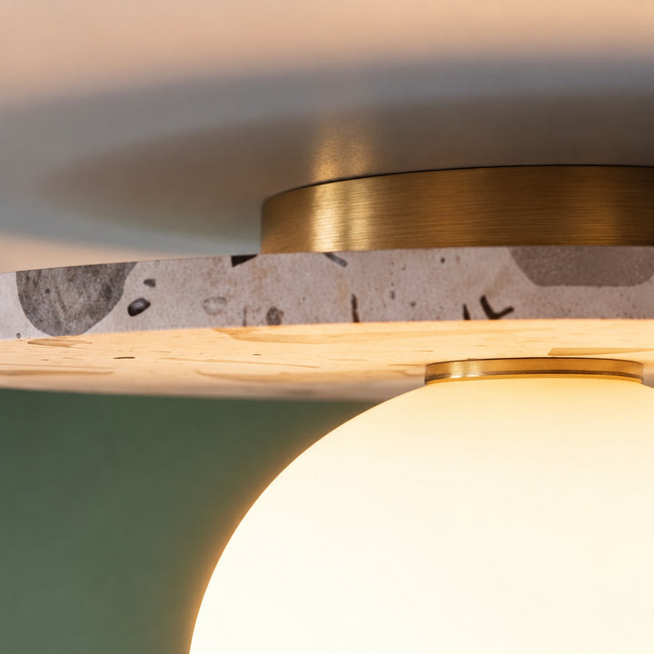 Modern Terrazzo Flush Mount Ceiling Light with Spherical Glass Shade and Copper Accents for Ambient Illumination