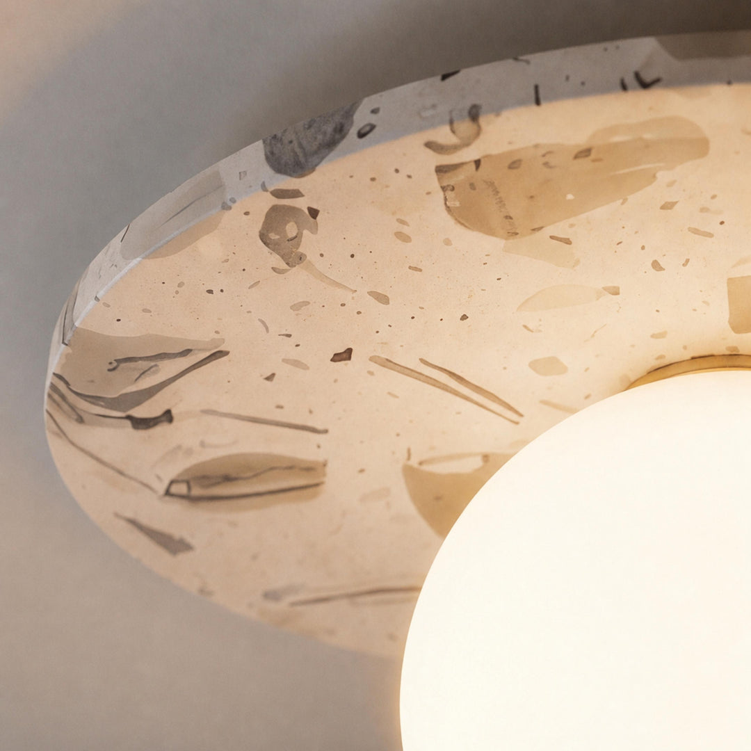Modern Terrazzo Flush Mount Ceiling Light with Spherical Glass Shade and Copper Accents for Ambient Illumination