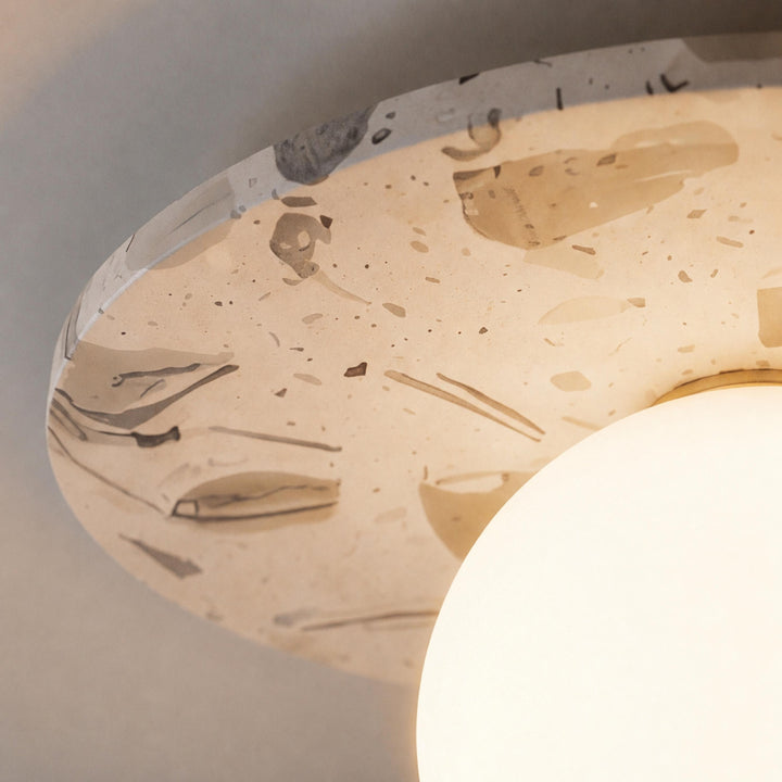 Modern Terrazzo Flush Mount Ceiling Light with Spherical Glass Shade and Copper Accents for Ambient Illumination