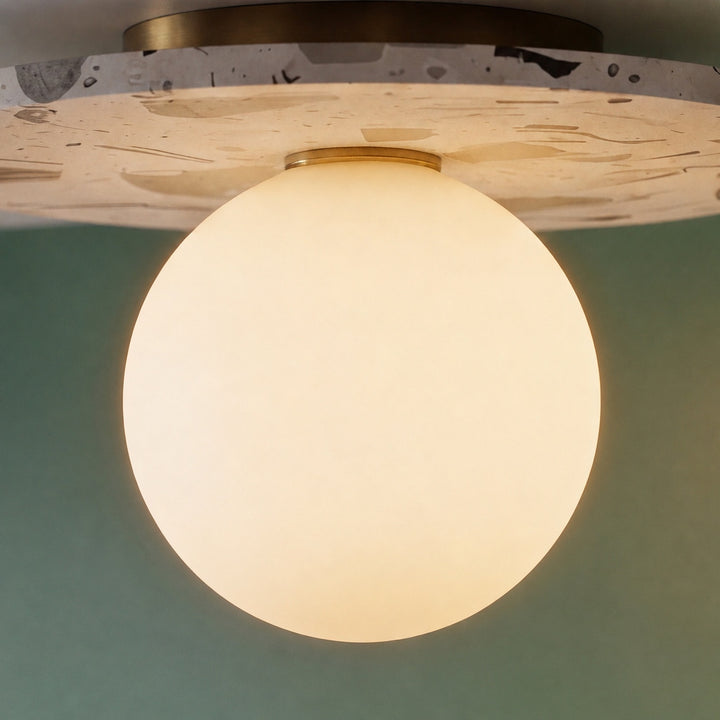 Modern Terrazzo Flush Mount Ceiling Light with Spherical Glass Shade and Copper Accents for Ambient Illumination