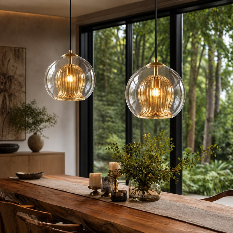 Two Ribbed Glass Globe pendants over a timber bench in front of large windows