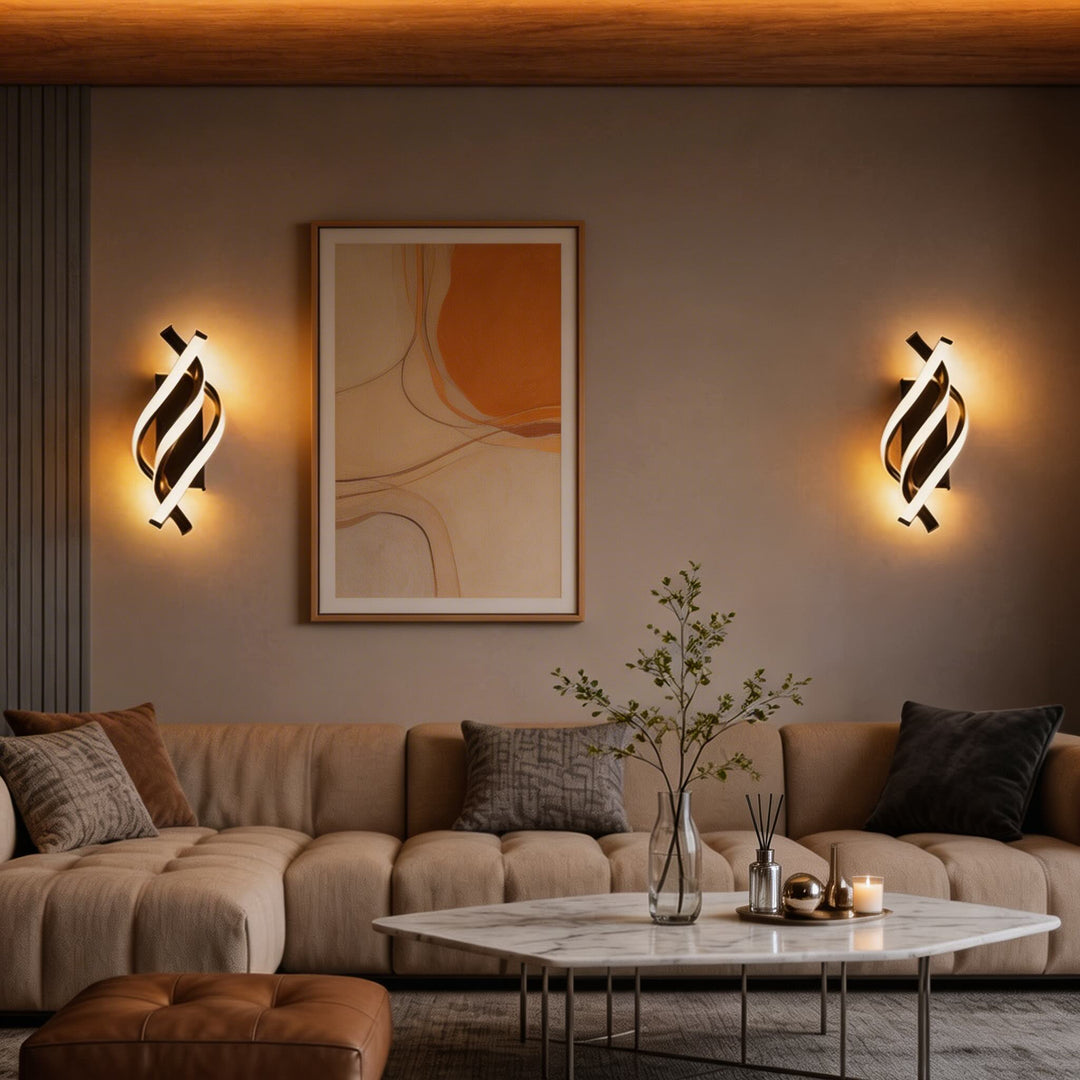 Pair of black spiral LED wall sconces with warm glow flanking artwork, designer living room wall lights Australia