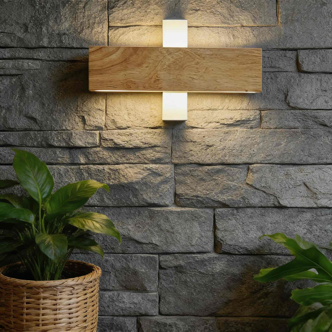 Horizontal oak timber wall sconce with up-down warm LED light on stone wall, outdoor wall light Australia