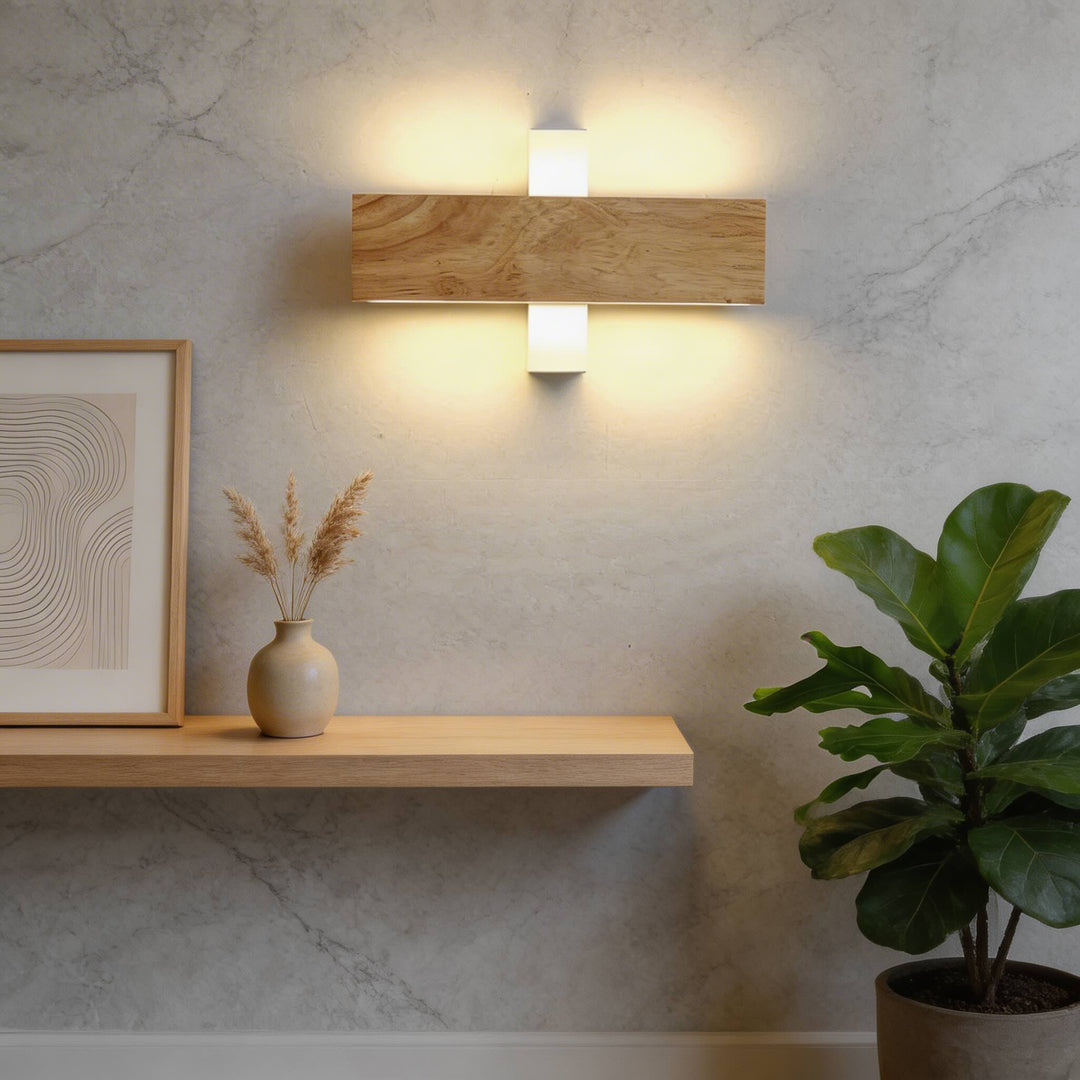 Horizontal oak timber wall sconce with white up-down LED caps, warm ambient glow on marble wall Australia