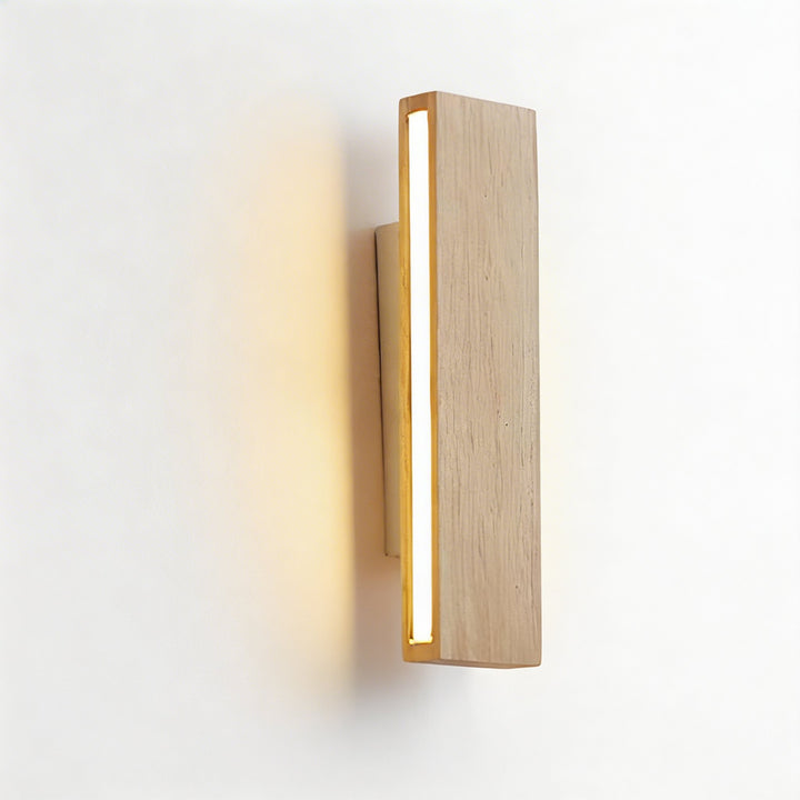 Light ash wood rectangular wall sconce with recessed vertical LED strip and warm gold accent lighting