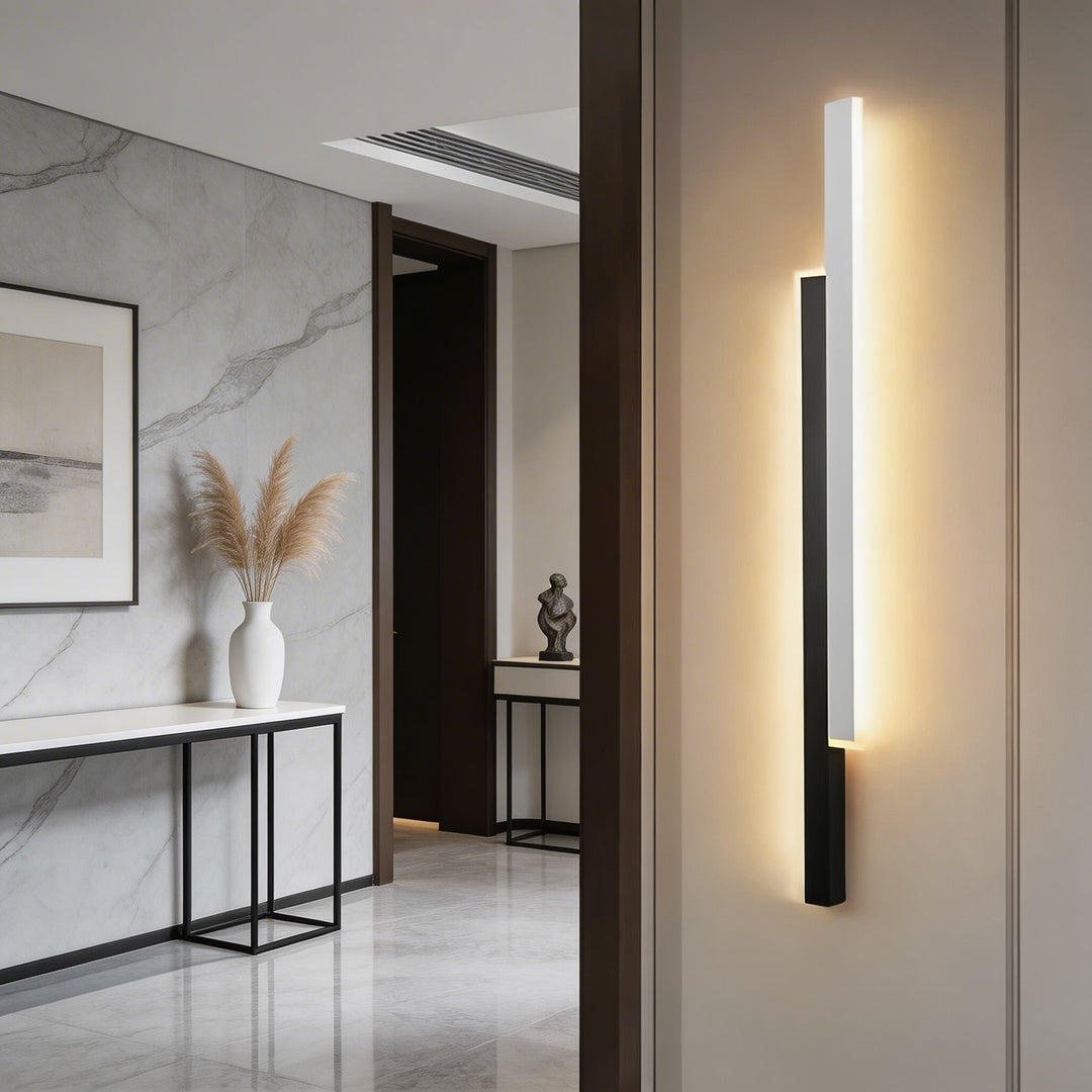 Wall sconces in black and white metal with elongated LED design, contemporary vertical wall light with soft glow and minimalist appeal