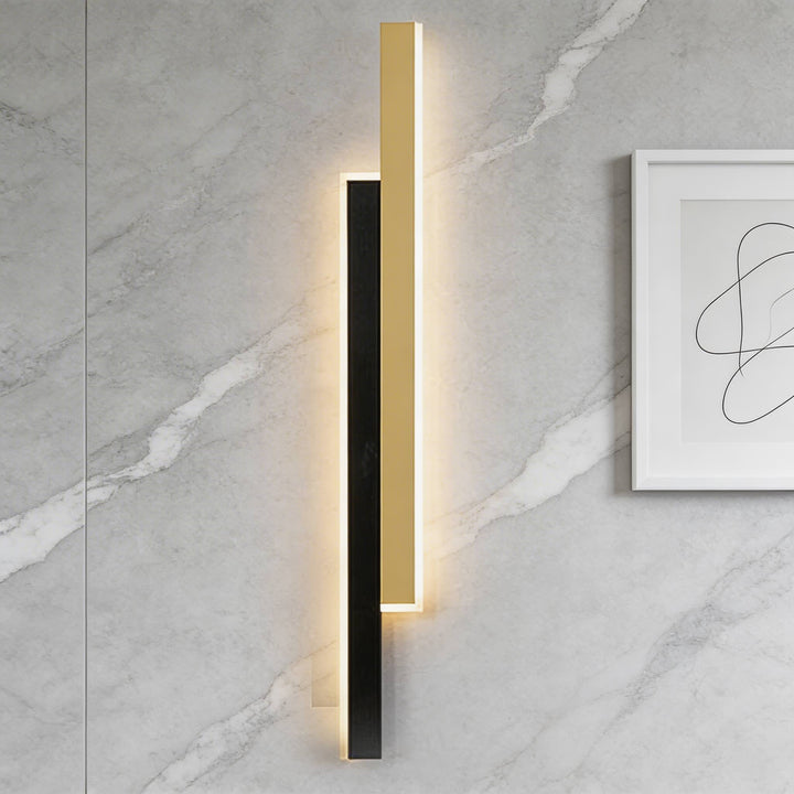 Wall sconces in black and gold metal with integrated LED glow, sleek vertical design with modern lines for elegant ambient lighting