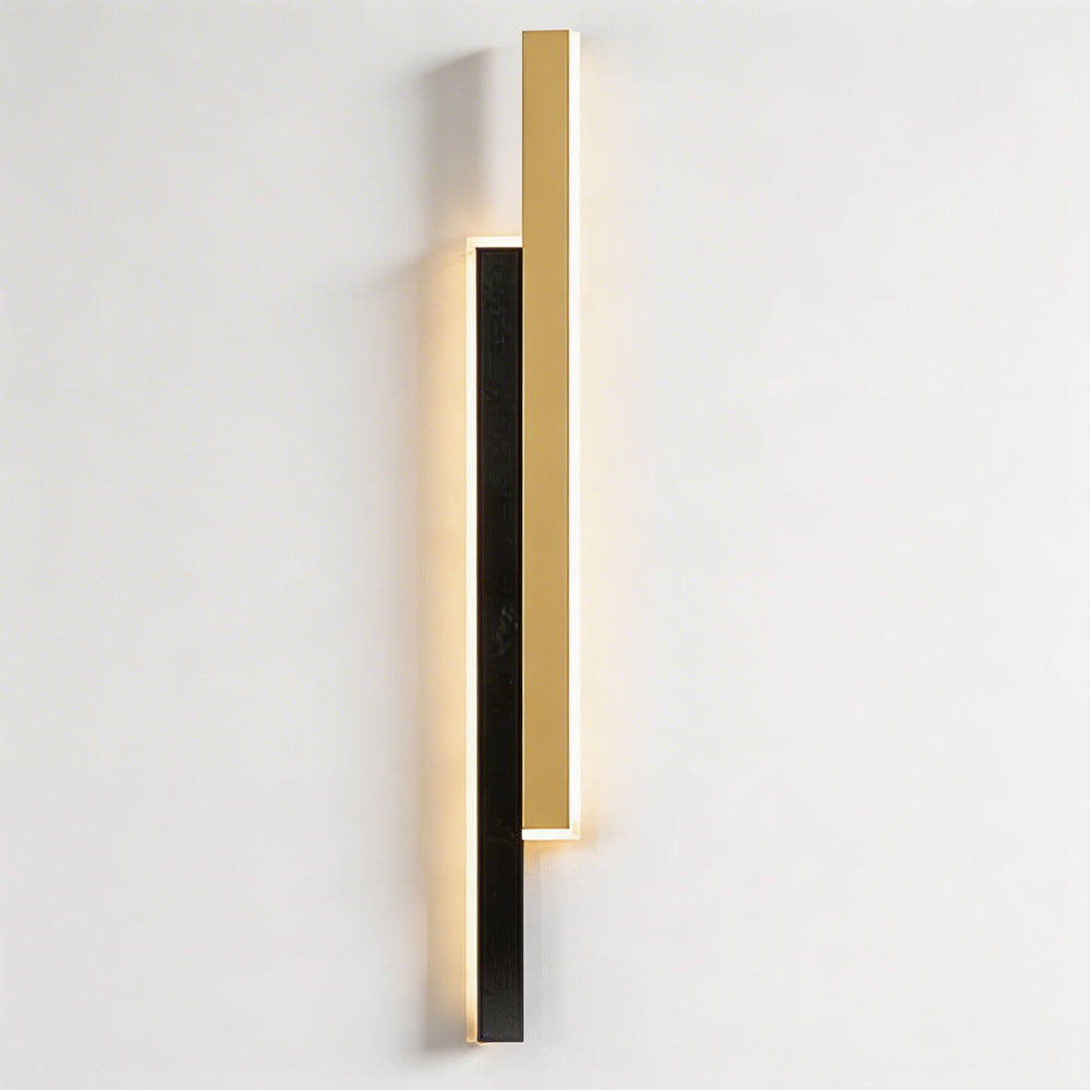 Wall light in black and gold finish with slim linear LED design, modern vertical sconce with warm glow and minimalist geometric style