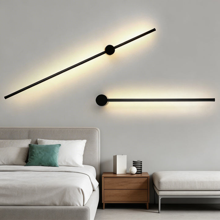 Wall sconces in matte black with elongated LED bars, sleek modern wall lights with circular mount detail and soft ambient illumination