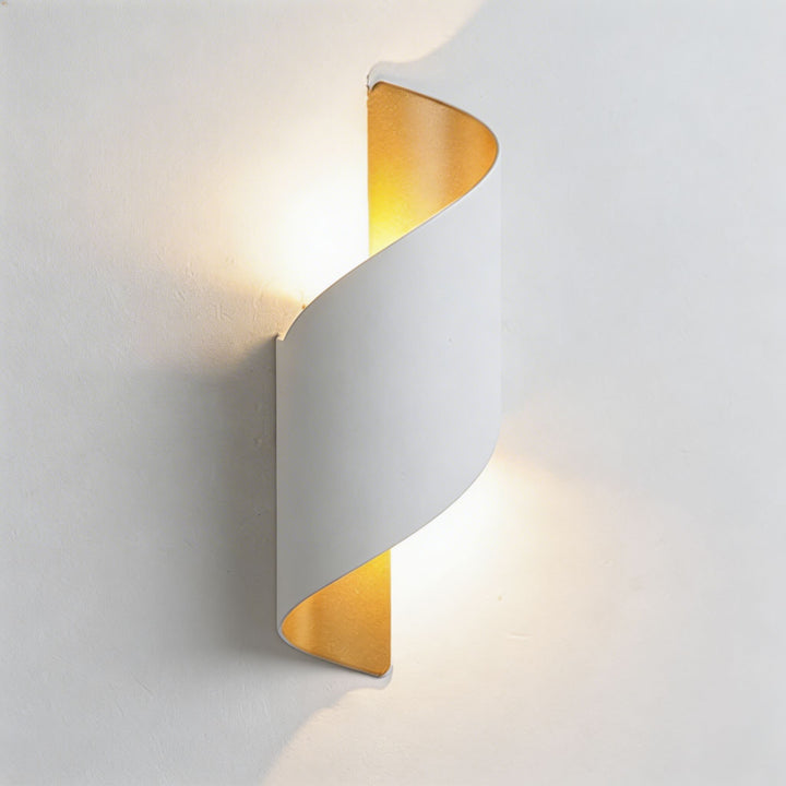 Wall sconce in white twisted design, modern wall light with warm up and down illumination and refined sculptural silhouette