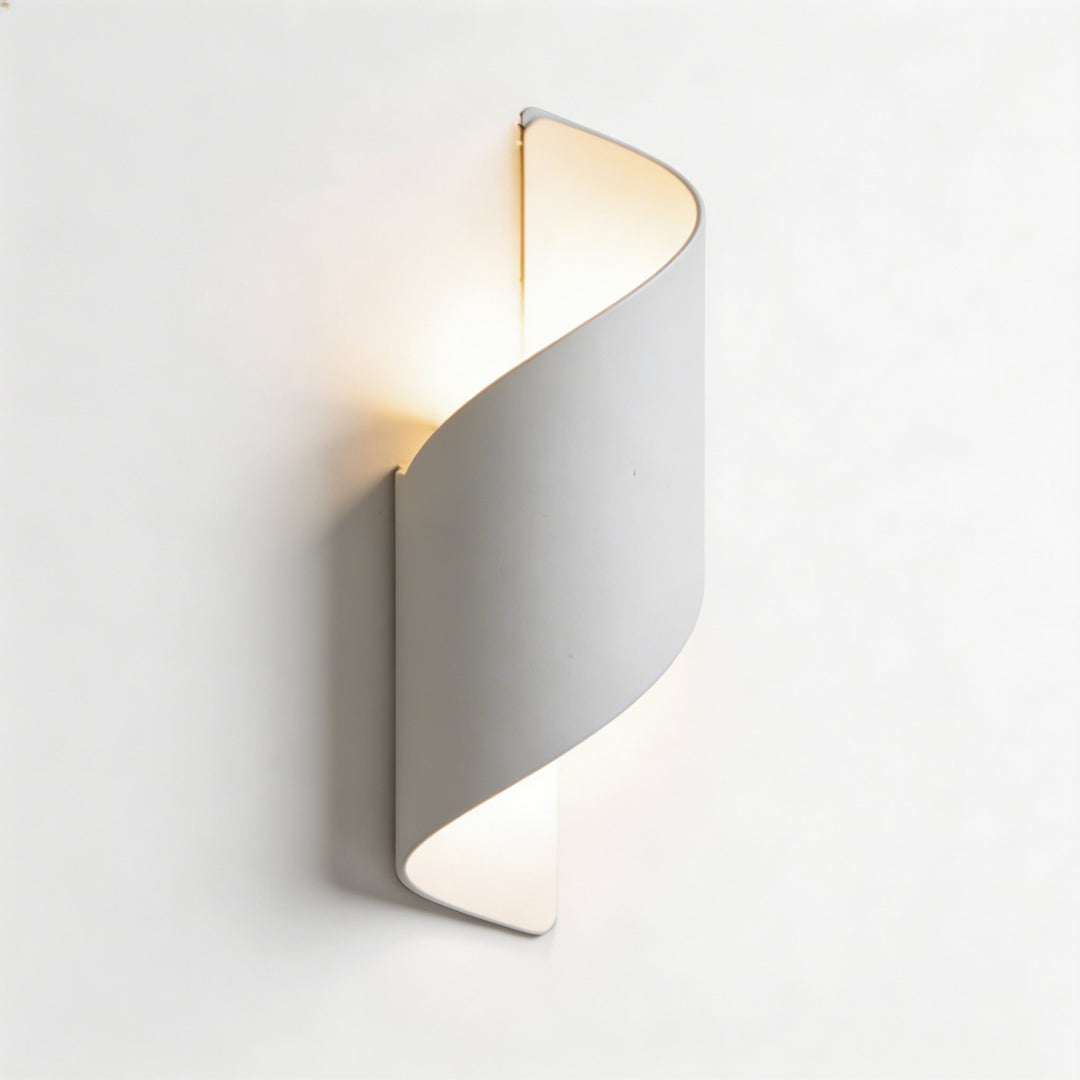 Wall sconce in white twisted design, modern wall light with soft up and down illumination and elegant curved silhouette