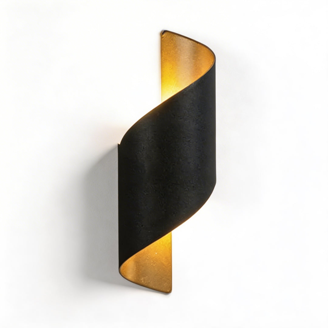Wall sconce in black twisted design, modern wall light with warm up and down illumination and striking curved silhouette