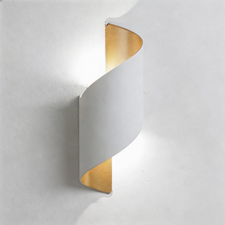 Wall sconce in white twisted design, modern wall light with soft up and down illumination and sleek curved silhouette
