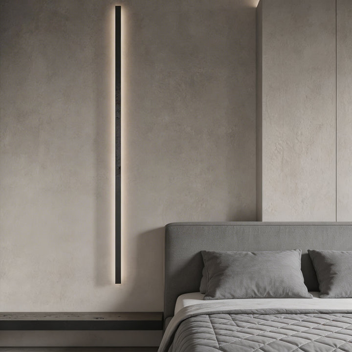 Floor to ceiling black vertical LED wall sconce with warm side glow, tall linear bedroom wall light Australia