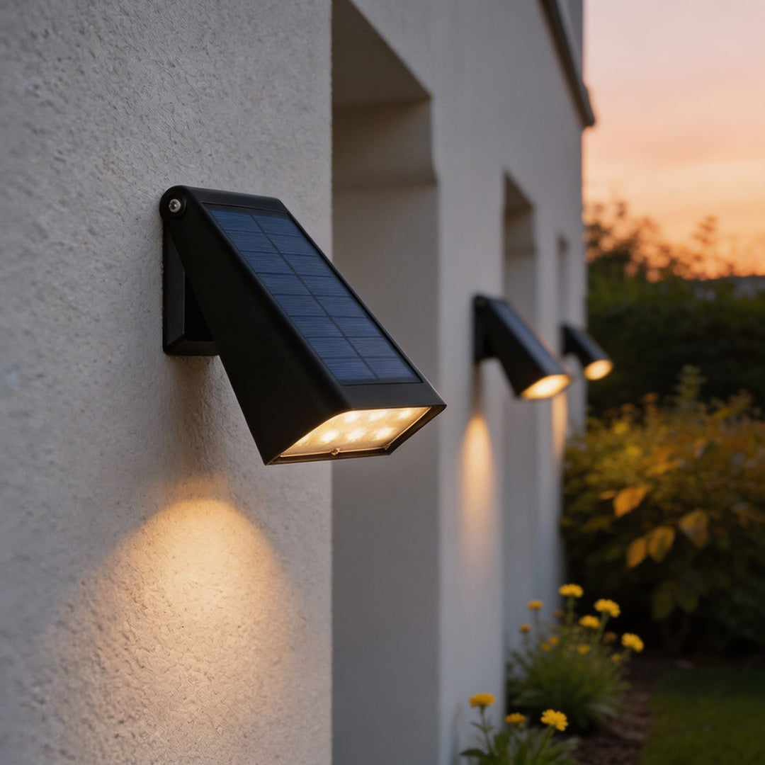 Wall lights black solar LED wall sconce with angled rectangular body, built in solar panel and warm downward glow for modern outdoor lighting fixtures