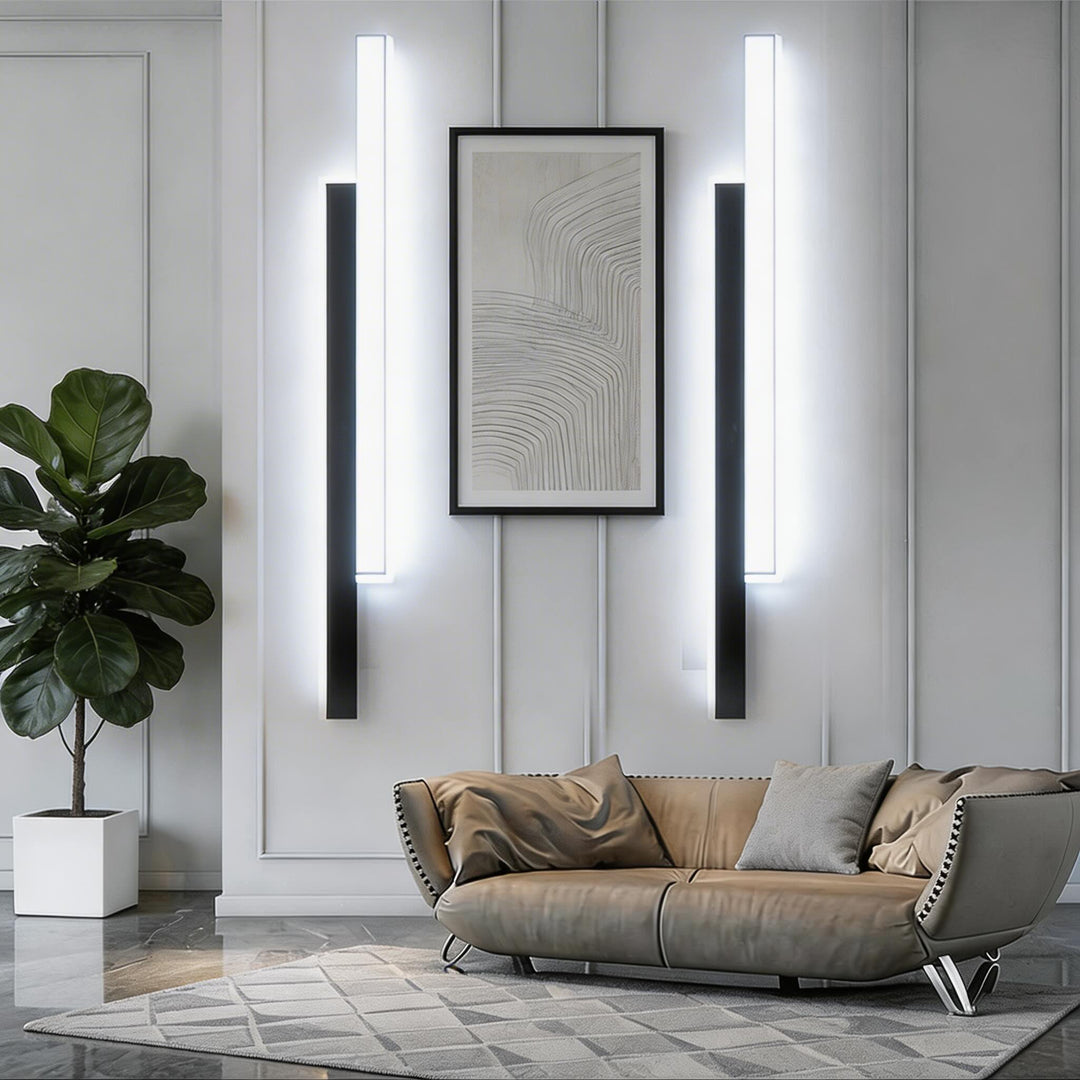 Wall sconces in black and white finish with slim vertical LED bars, minimalist modern wall lights with bright integrated illumination and sleek form
