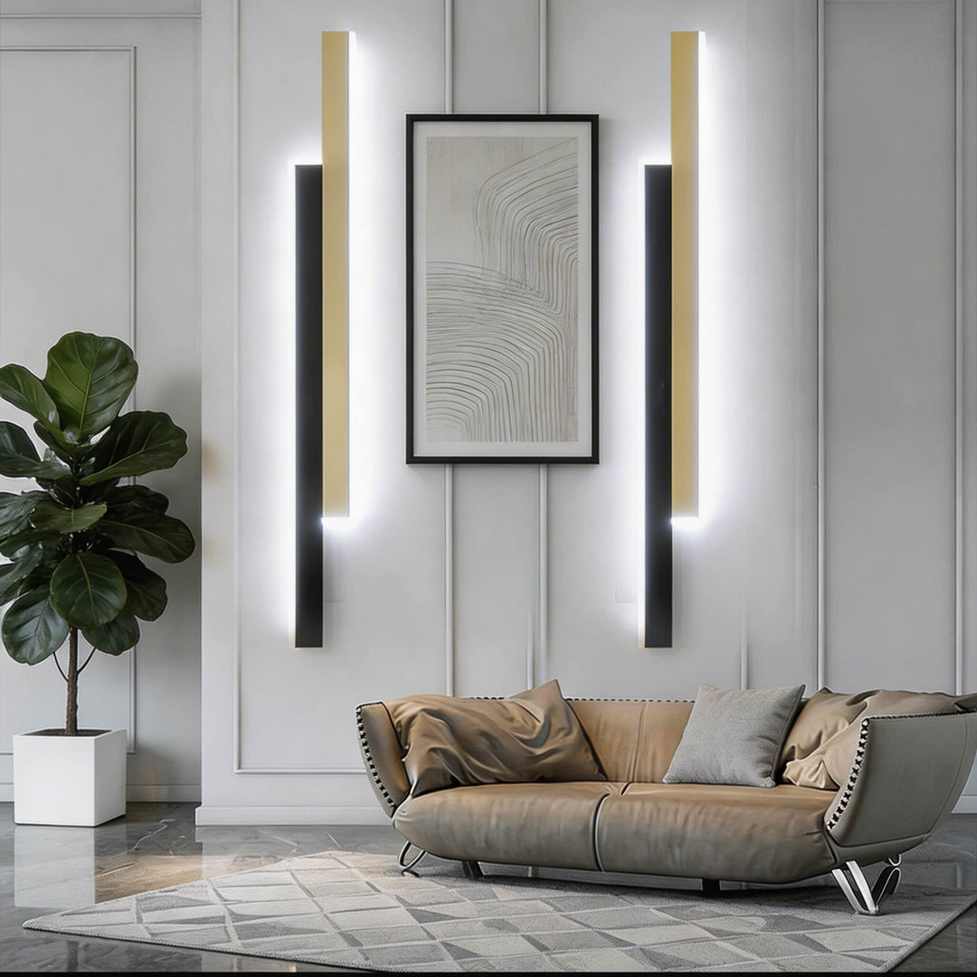 Wall sconces in black and gold finish with slim vertical LED bars, modern linear wall lights with bright integrated glow and luxe style