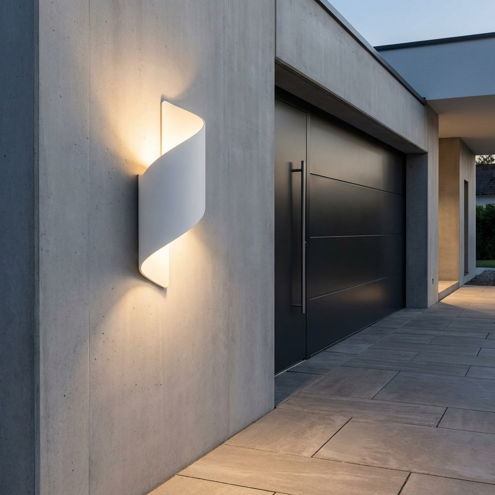 Wall light in white twisted design, modern outdoor sconce with soft up and down illumination and sleek sculptural silhouette
