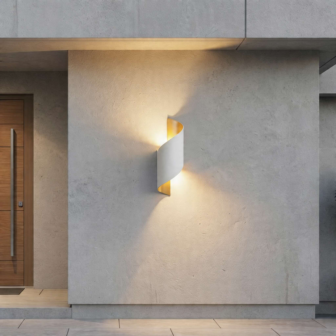 Wall sconce in white twisted design, modern outdoor wall light with warm up and down illumination and clean sculptural silhouette