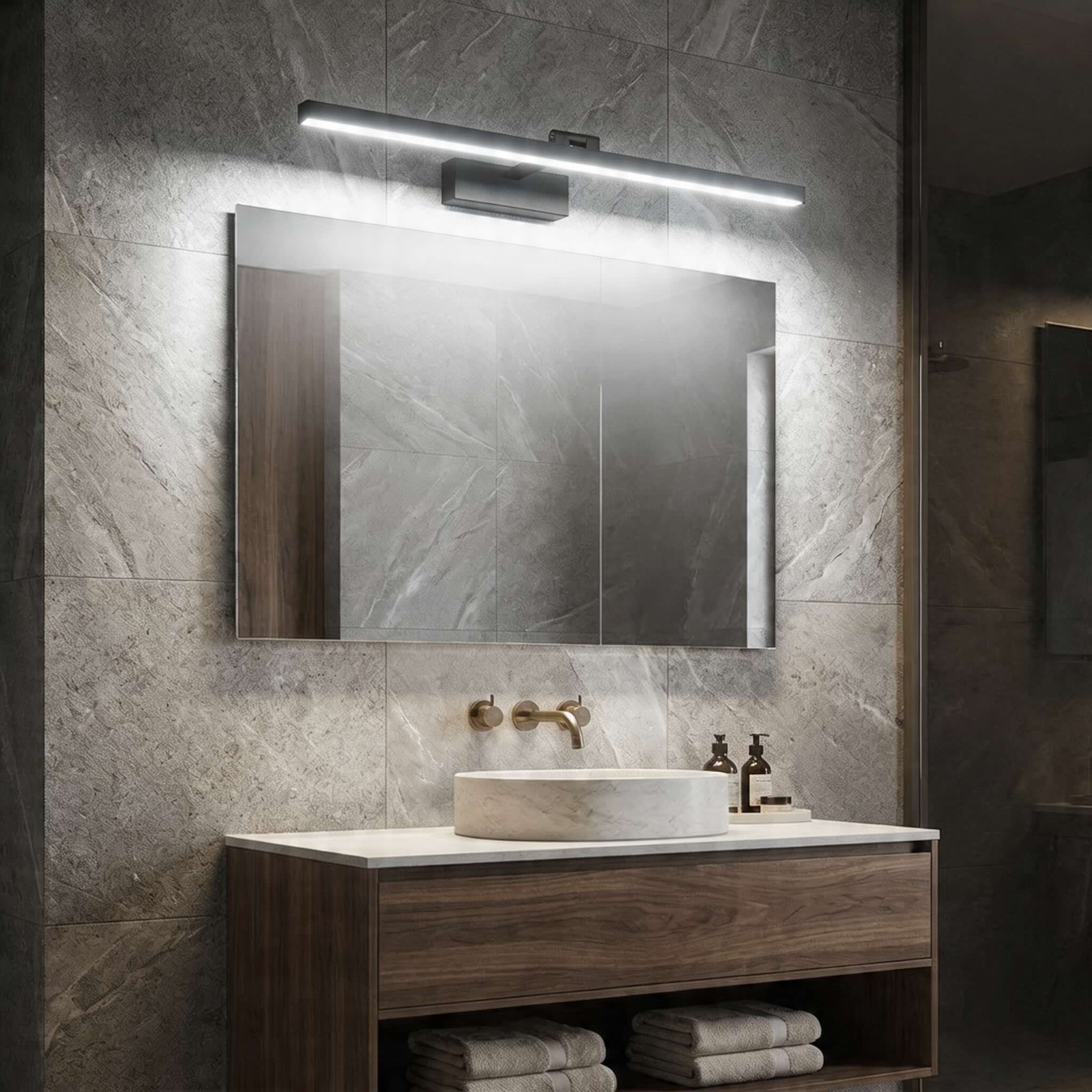 Modern metal and acrylic vanity light with dual colour temperature above a bathroom mirror